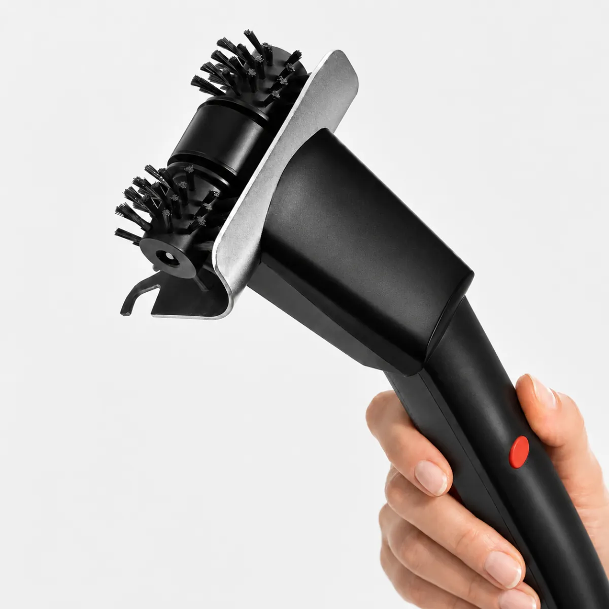 Wamoma GrillMaster cordless electric grill brush held in hand